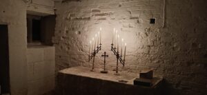 These antique candelabras are designed for flexibility. They can form a Tenebrae hearse flanking a lantern for that observance, and be reconfigured for other liturgical uses, including interfaith services.