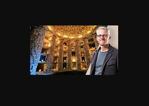 Tom Holland the historian and the interior of the Soulton Long Barrow, a hand built stone chamber with colums and a dome roof