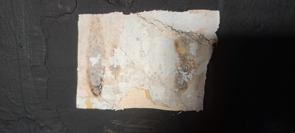 These two faint candle marks on the wall hint at the former location of a desk or writing surface. Could they mark a spot of past scholarly activity?