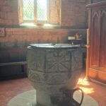 Romanesque font in Hodnet Church, removed from Tong to Hodnet