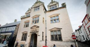 he gatehouse of Plas Mawr, showing its characteristic Renaissance crow-stepped gables, pedimented windows and heraldry
