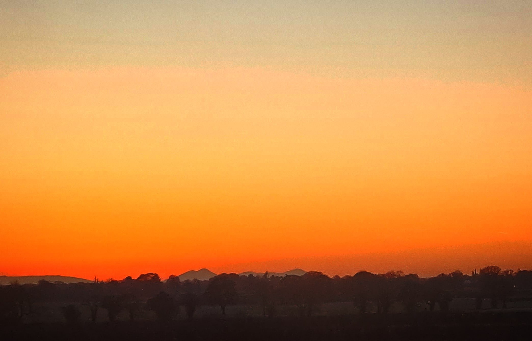View to Wales from Soulton in a bright red sunset