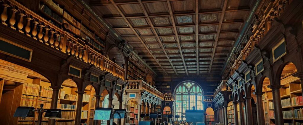 A quiet moment of research in the Duke Humfrey's Library, a beautiful reading room within the Bodleian Library in Oxford. This iconic space, with its towering bookshelves andancient wood is humbling.