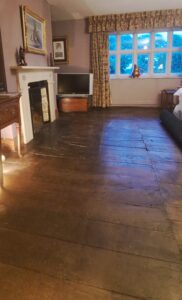 In the Deakin Room, a Persian rug is rolled back to expose a secret: a seam in the floorboards, running north-south. Another clue to Sir Rowland Hill's hidden message encoded in the building's design?