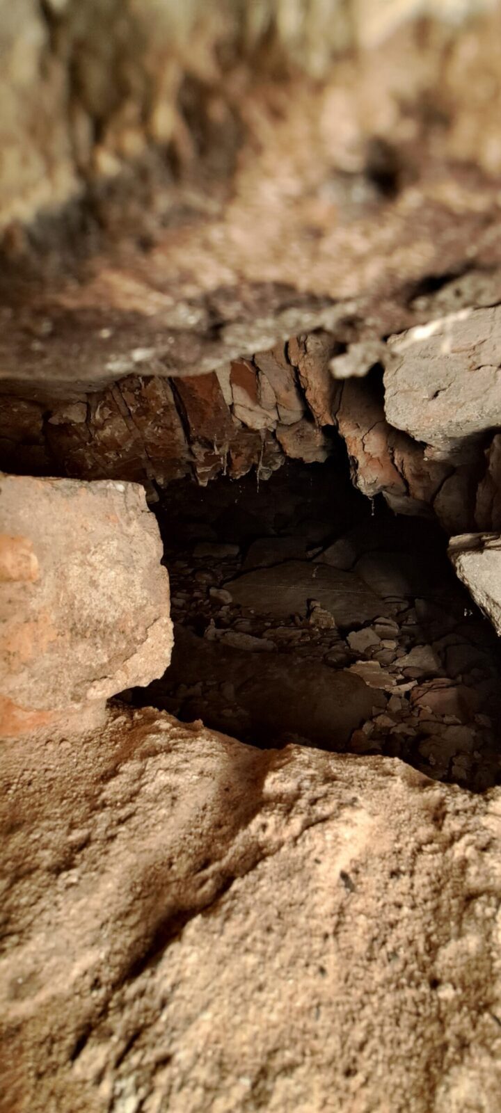 This image reveals a curious void inserted into the structure of the house. Intriguingly, it a has a flue that connects to the chimney of the Blue Room fireplace. It is over a meter square inside.
