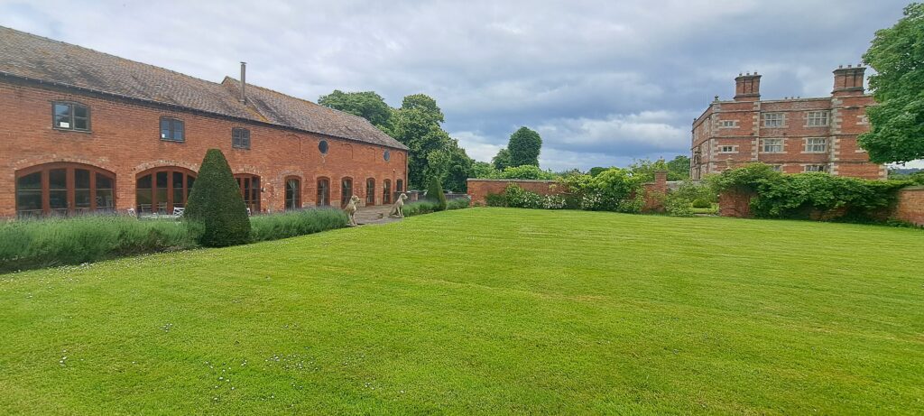 Soulton Court, Base Court (the garden), and the building now called Soulton Hall built by Old Sir Rolwand as a corps de logis beyond.