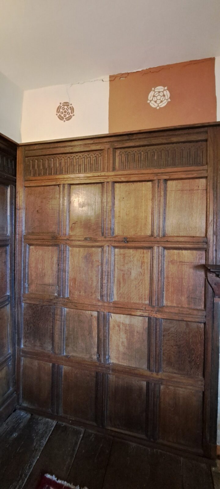 The only remaining section of wood paneling installed by Sir Rowland Hill himself in the 1550s. Look closely at the frieze for a delightful detail!