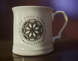 A Mug showing the Soulton Hall Logo