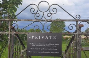 Sign on a gate to the Epidaurus Court