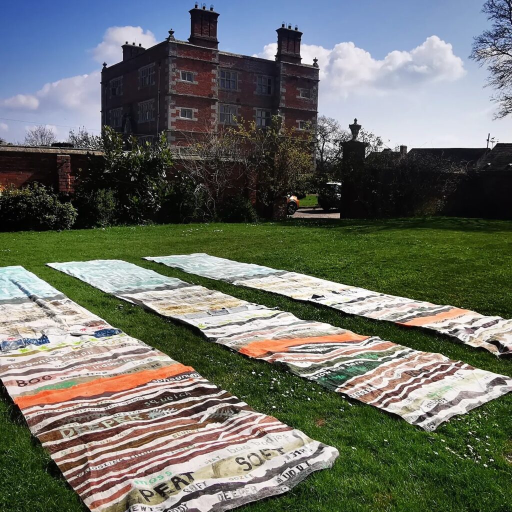 peat-surface-sky - art banners on the lawn