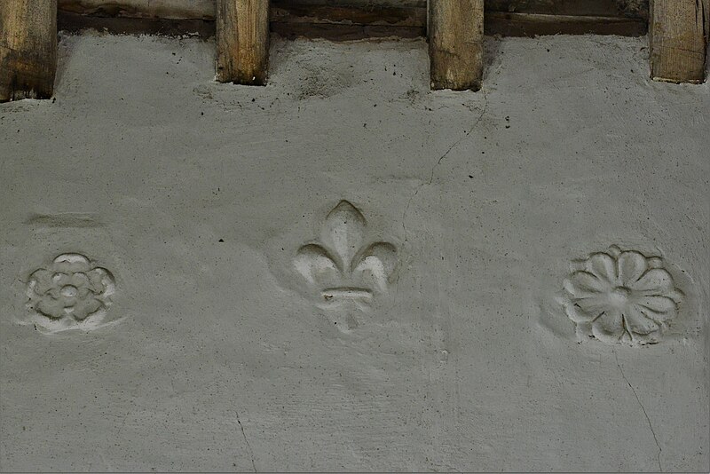 Plasterwork showing Eleusinian flowers , Tudor Rose and fleur de lis