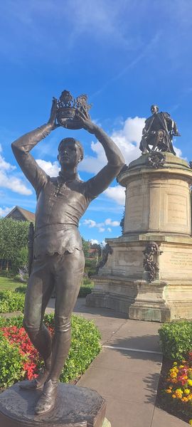 This Victorian sculpture of Prince Hal fails to capture the dynamic and complex character portrayed in Shakespeare's plays. Rendered in a stiff and overly dramatic pose, the statue falls short of conveying the young prince's journey from rebellious youth to noble king.