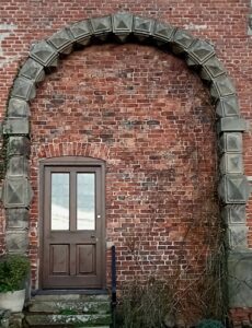 The striking Porters Lodge arch at Bachygraig, adorned with intricate rhombic dodecahedrons, reflects the architectural vision of Sir Richard Clough, echoing the innovative spirit of his mentor, Sir Rowland Hill.