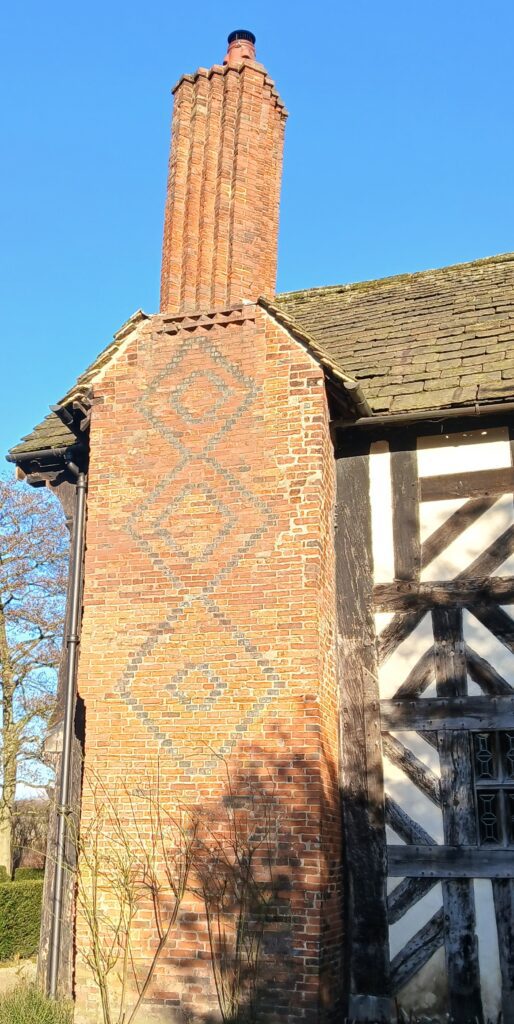 Diaper brickwork at Little Moreton Hall. Similar patterns at Soulton Hall have been linked to the Jewish Sephirot and the rhombic dodecahedron, suggesting potential symbolic significance here as well