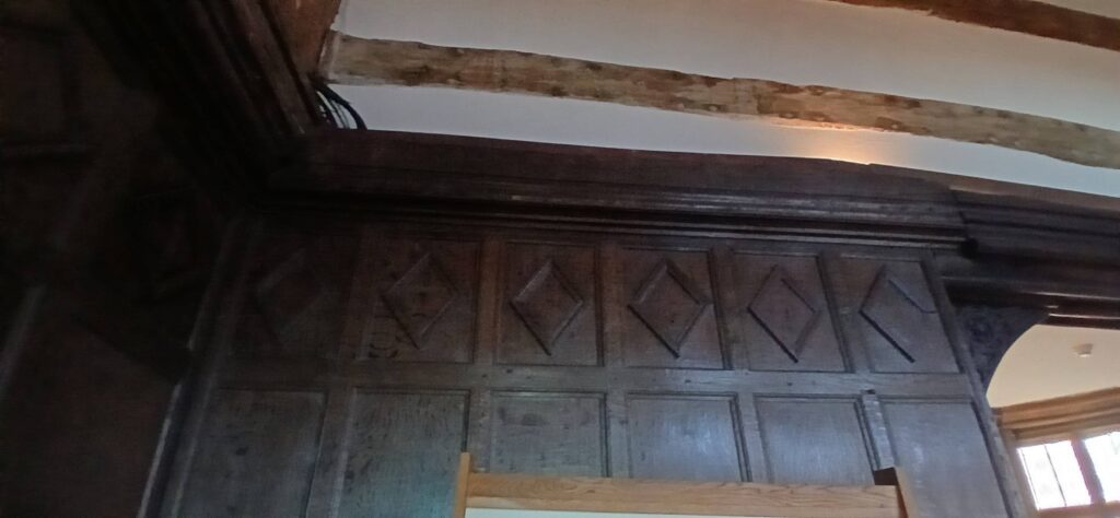 Detail of the Great Hall panelling, featuring tilted square designs