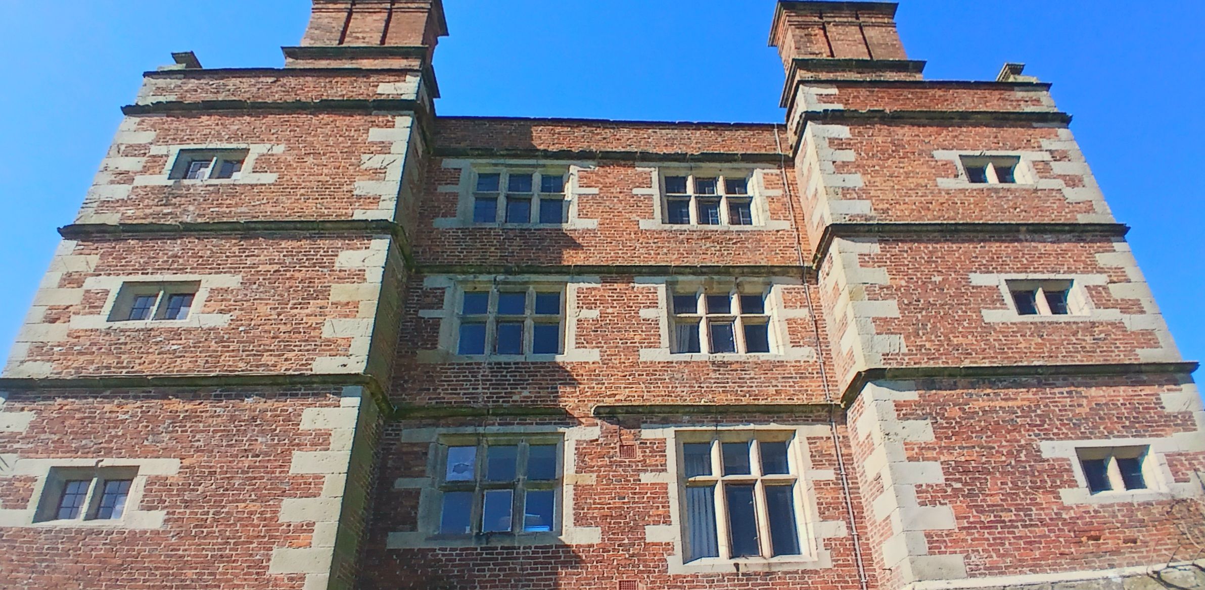 East Front Observations: Window Asymmetry and Quoin Quirks