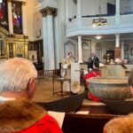 Inside the service, Cllr Wagnar receiving the civic sword of Shrewsbury from Rev'd Samuel Mann, Vicar of St Chads. Image: Ben Jephcott.