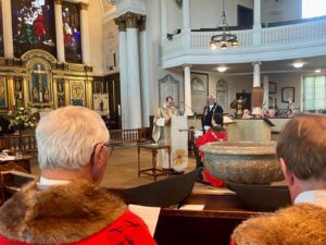 Inside the service, Cllr Wagnar receiving the civic sword of Shrewsbury from Rev'd Samuel Mann, Vicar of St Chads. Image: Ben Jephcott.