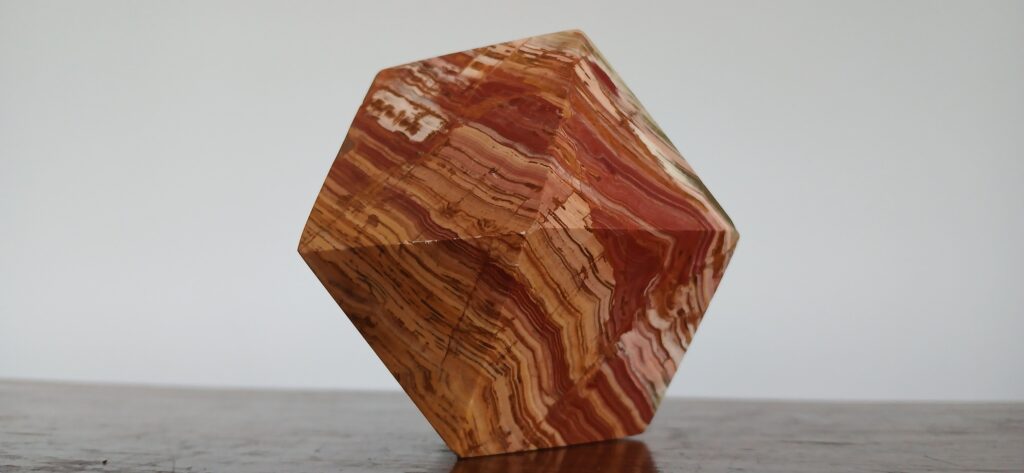 This fantastic marble cube-octahedron, a recent gift, helps us truly see the geometric principles that fascinated Old Sir Rowland Hill. It's an insight into the 'garnet code' and Soulton Hall's unique design.