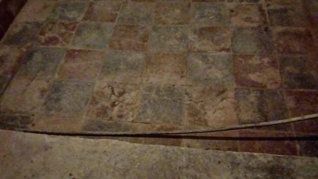C16th tiled floor in the Buttery Hall