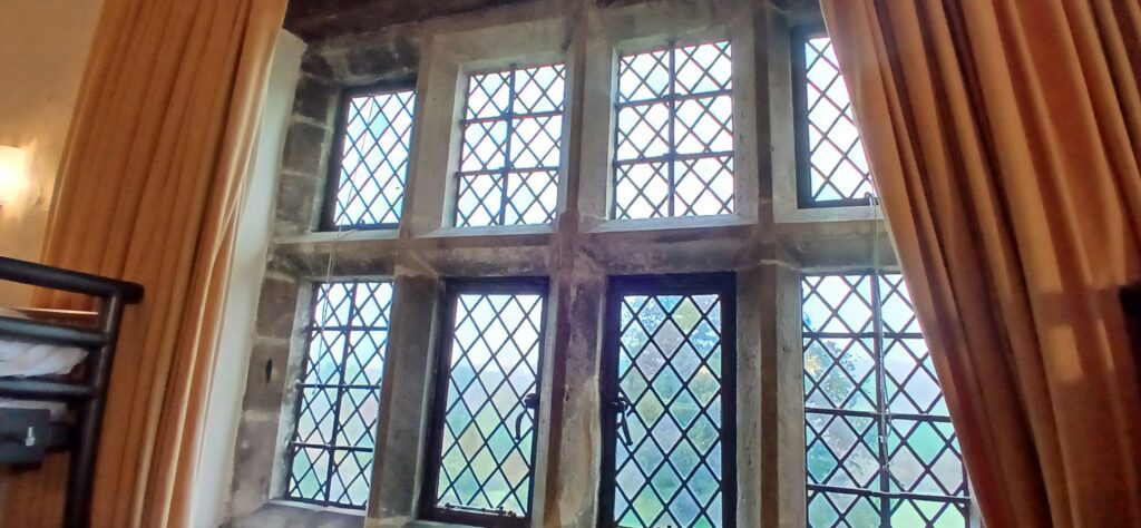 Window stone mullions at Wilderhope are tilted square in cross-section—an earlier profile than ovolo and other moldings—mirroring those found at Soulton.