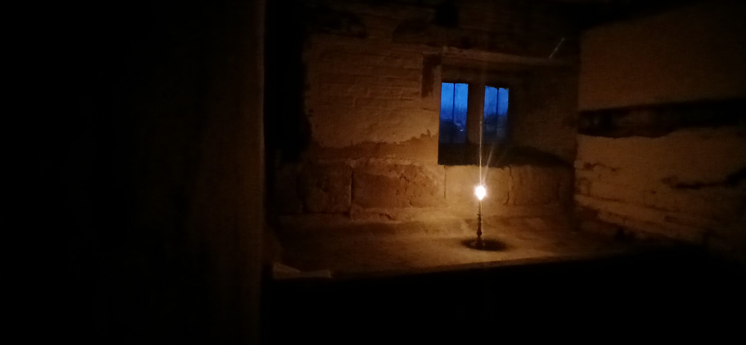Gemini saidPlaced within the Aedicule on the evening of Good Friday 2026, this Sole Candle acts as a piece of neoplatonic domestic liturgy, showing how the 16th-century house carries its ideas through stone. The "hidden light" is set deep within the chamber—which architecturally represents a tomb—to symbolize a presence that remains even when it is not visible to the world. As a visual metaphor for the Harrowing of Hell, this act uses the house to manifest the story of light entering the deepest darkness.