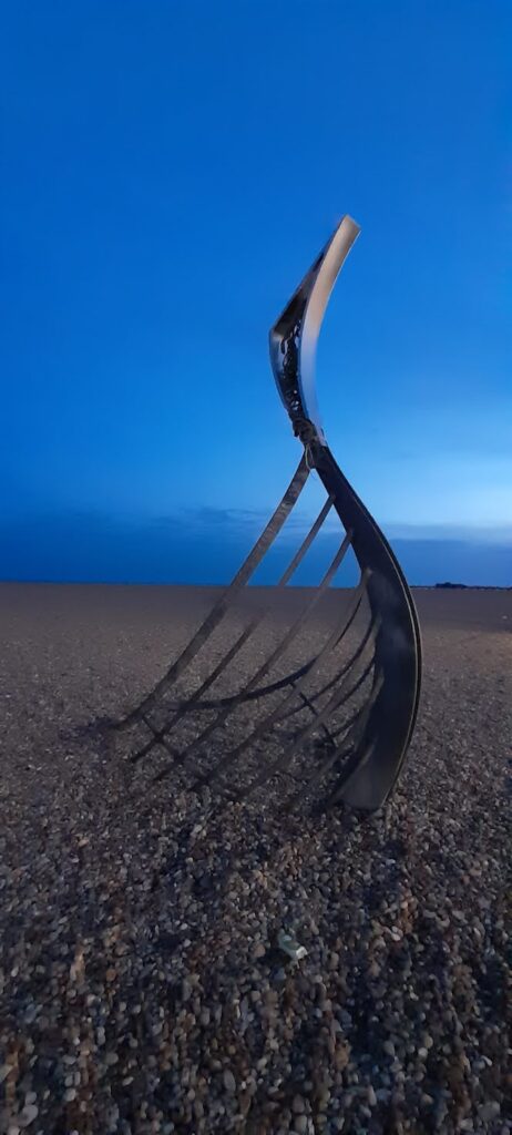 The sharp, upward sweep of the steel prow sculpture on the seafront stands as a bold, modern reminder of the vessels that once cut through these waters to reshape the course of our history.