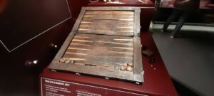 The backgammon board provides a rare look at the moments of leisure aboard, serving as a reminder that even in the midst of a naval voyage, the men sought to pass the long hours with familiar games of strategy and chance.