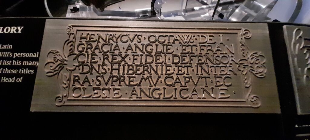 Cast during the mid-1500s, this declaration—"HENRYCVS OCTAVVS DEI GRACIA ANGLIE ET FRANCIE REX FIDEI DEFENSOR DNS HIBERNIE ET IN TERRA SVPREMV CAPVT ECCLESIE ANGLICANE," translating to "Henry the Eighth, by the Grace of God, King of England and France, Defender of the Faith, Lord of Ireland, and on Earth Supreme Head of the Church of England"—demonstrates how the crown codified a new national identity by legally anchoring the supreme oversight of the realm's religious life directly to the monarch.