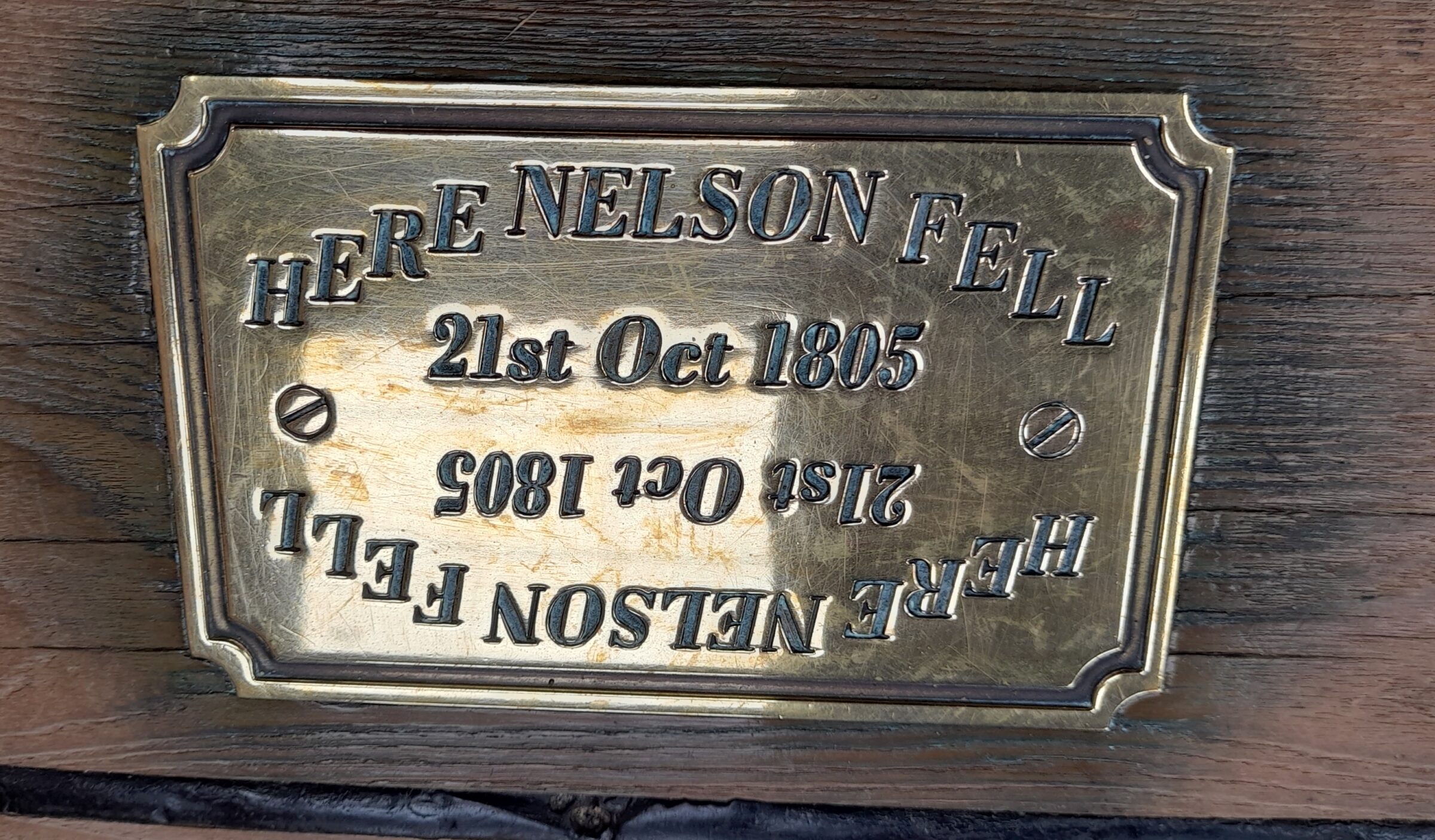 On the open quarterdeck, exposed to the elements and the chaos of engagement, a simple brass plaque set into the timber marks the exact, prominent spot where Nelson fell when a sniper's bullet struck him down at the height of the battle.