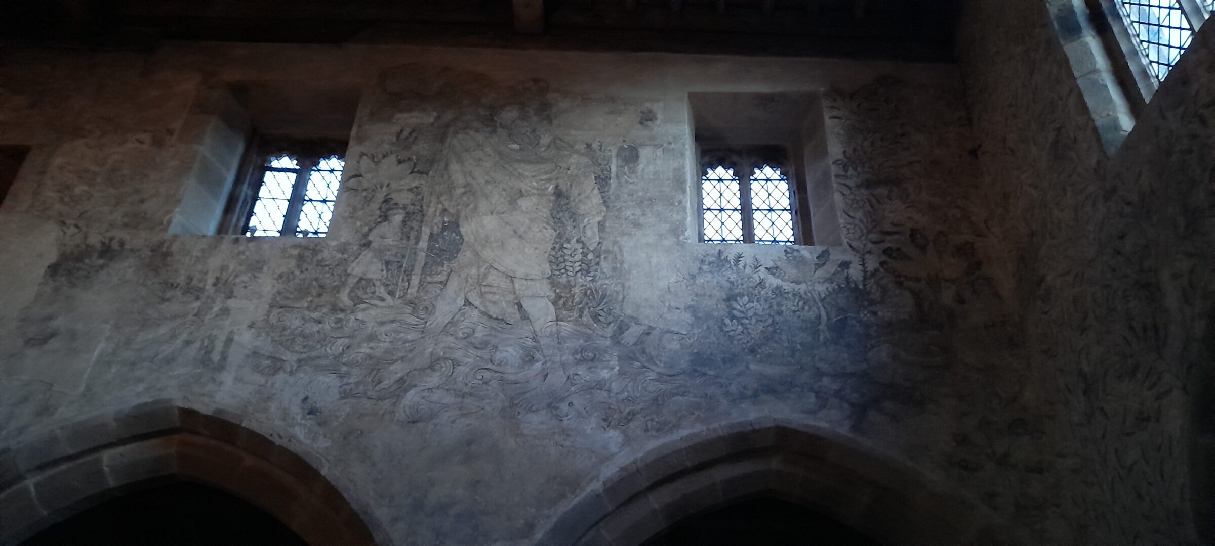 St Christopher in an exquisite wall painting in the Haddon Hall Chapel